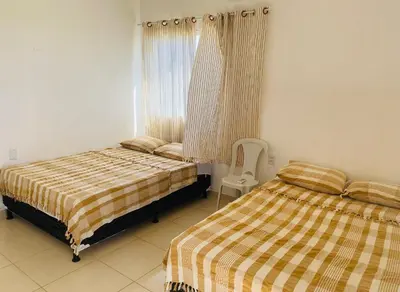 Uma cama ou camas num quarto em Gold Star Village Kitnet equipado