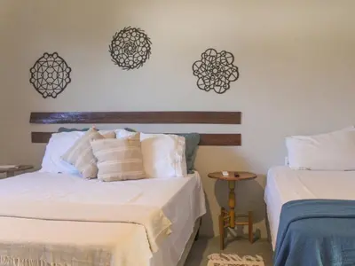 Uma cama ou camas num quarto em Vila Serenitá