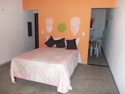Uma cama ou camas num quarto em CHALÉ COQUEIROS