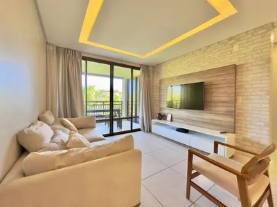 Uma televisão e/ou sistema de entretenimento em Mandara Lanai Resort - Porto das Dunas