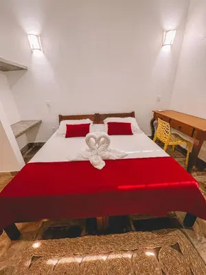 Uma cama ou camas num quarto em Pousada Fortal Preá