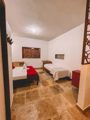 Uma cama ou camas num quarto em Pousada Fortal Preá