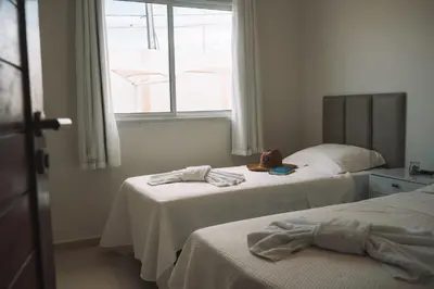 Uma cama ou camas num quarto em Quality - Boas Vistas