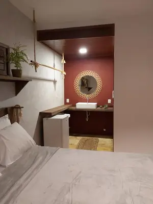 Uma cama ou camas num quarto em Pousada Flor de Lena- Lotus