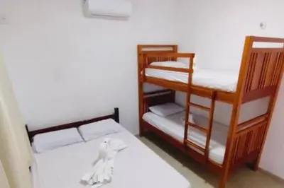 Uma cama ou camas num quarto em Casa do Sol Flecheiras
