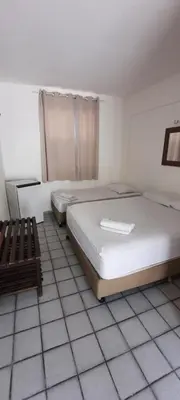 Uma cama ou camas num quarto em Pousada Temporada Atlântica