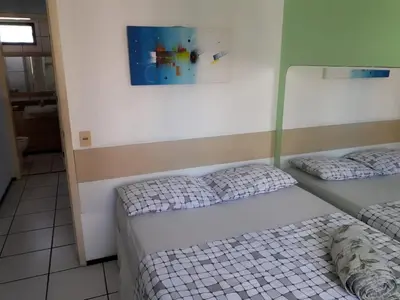 Uma cama ou camas num quarto em Apartamento Residence Praia Porto Iracema