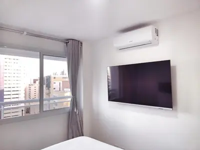 Uma televisão e/ou sistema de entretenimento em S Flats Mota