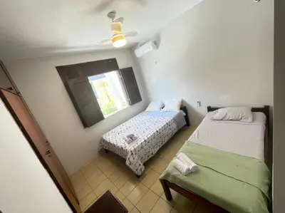 Uma cama ou camas num quarto em casa brisa do mar