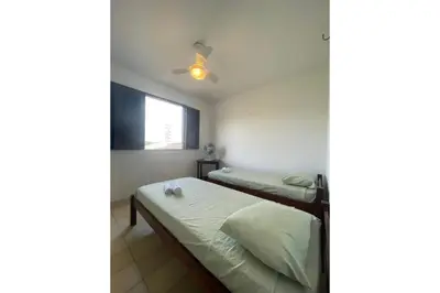 Uma cama ou camas num quarto em casa brisa do mar