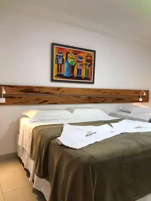Uma cama ou camas num quarto em Suítes Flecheiras