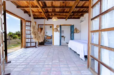 Uma cama ou camas num quarto em Bangalô do Vento - Praia do Preá