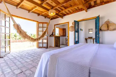 Uma cama ou camas num quarto em Bangalô do Vento - Praia do Preá