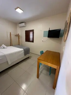 Uma cama ou camas num quarto em Viva Praia Flats, maravilhosa hospedagem na praia!
