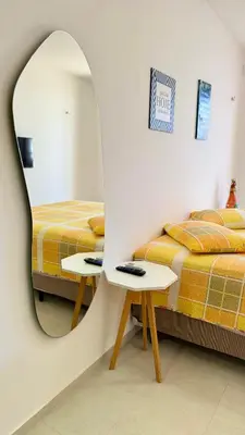 Uma cama ou camas num quarto em Lounge Pdd - Espaço inteiro