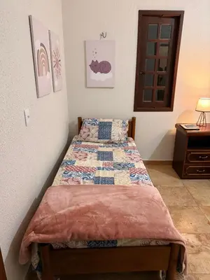Uma cama ou camas num quarto em Sítio São Gerardo - Aconchegante casa no campo.