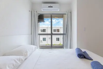 Uma cama ou camas num quarto em Beach Townhouses #C05 - Com Jacuzzi por Carpediem