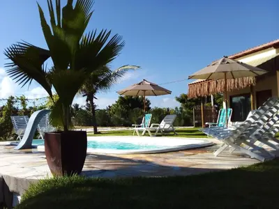 A piscina em ou perto de Chalés Ed Moitas
