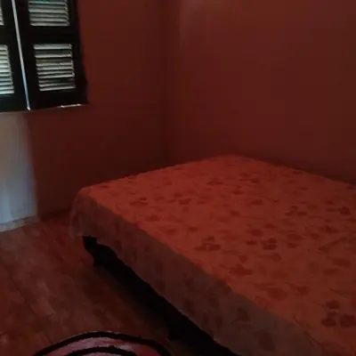 Uma cama ou camas num quarto em Recanto Silvia Timbó