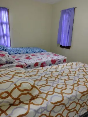 Uma cama ou camas num quarto em Chalé para temporada no Centro de Guaramiranga