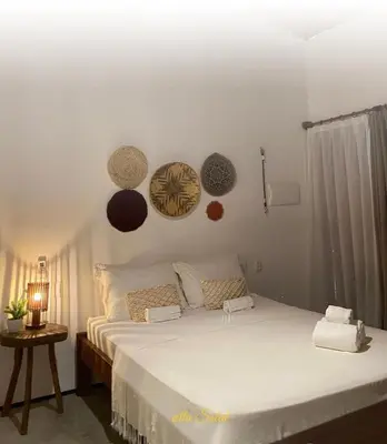 Uma cama ou camas num quarto em icaraizinho villa soleil