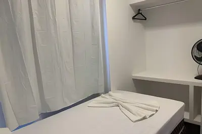 Uma cama ou camas num quarto em Hosts BR - Apartamentos funcionais
