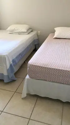 Uma cama ou camas num quarto em Vila do Porto Resort