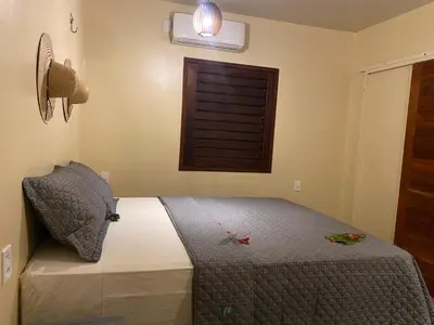 Uma cama ou camas num quarto em Casa Praiana Moitas