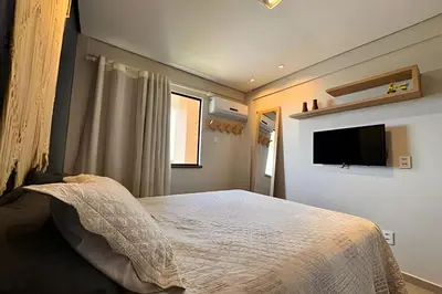Uma televisão e/ou sistema de entretenimento em Studio a 1km do Beach Park