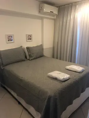 Uma cama ou camas num quarto em Landscape Platinum - Flat de frente para o Mar