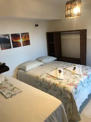 Uma cama ou camas num quarto em Restaurante & Pousada Portal dos Ventos