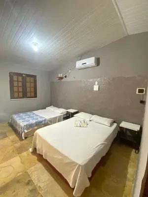 Uma cama ou camas num quarto em Condomínio em Canoa Quebrada