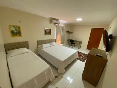 Uma cama ou camas num quarto em Bertolini Hotel