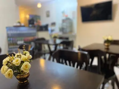 Uma televisão e/ou sistema de entretenimento em Bertolini Hotel