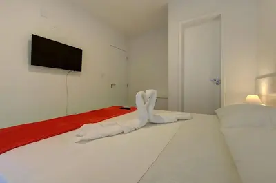 Uma cama ou camas num quarto em Beach Townhouses #C6 - Triplex por Carpediem