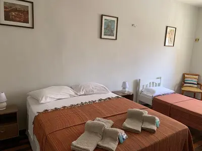Uma cama ou camas num quarto em Casa do Sol Fortaleza