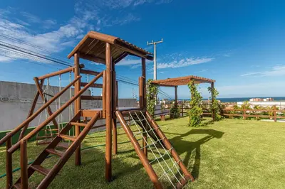 A área de jogos para crianças em Beach Townhouses #105 - Praticidade por Carpediem