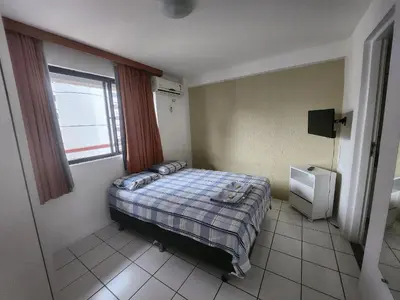 Uma cama ou camas num quarto em Condomínio Costa do Sol