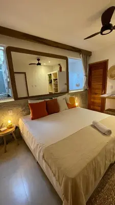 Uma cama ou camas num quarto em Piticcaia Lodge - Casa pé na areia, Frente mar - PREÁ