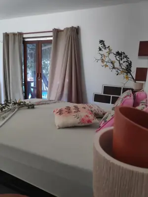 Uma cama ou camas num quarto em Anacardium