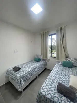 Uma cama ou camas num quarto em Casa em Condomínio Montserrat