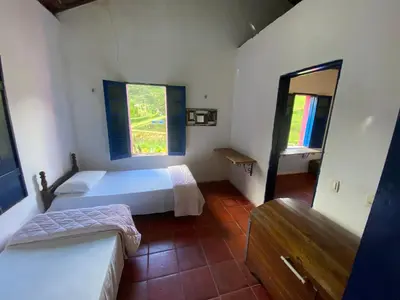 Uma cama ou camas num quarto em Solar dos Pássaros