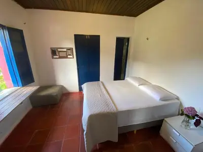 Uma cama ou camas num quarto em Solar dos Pássaros