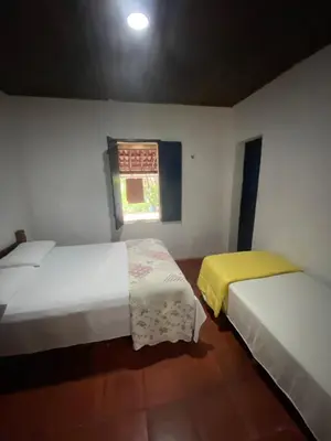 Uma cama ou camas num quarto em Solar dos Pássaros