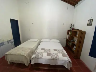 Uma cama ou camas num quarto em Solar dos Pássaros