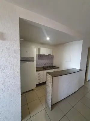 A cozinha ou kitchenette de Praia Mansa Suíte Hotel