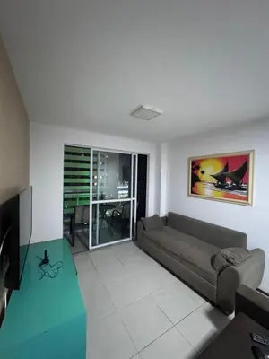 Uma área de estar em Apartament Beach Fortaleza