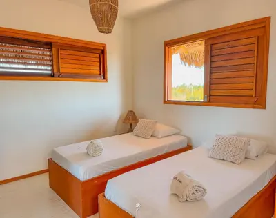 Uma cama ou camas num quarto em La Villa Dune, um luxo com vista espetacular por mar e coqueiral ! Uma experiência unica !