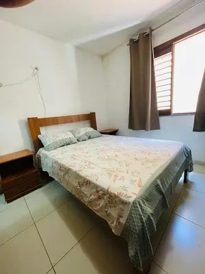 Uma cama ou camas num quarto em Aluguel Apto. Triplex Guaramiranga.