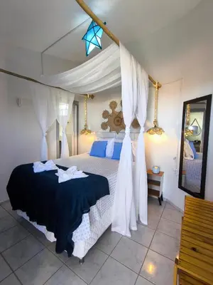 Uma cama ou camas num quarto em Hospedaria Mandacaru